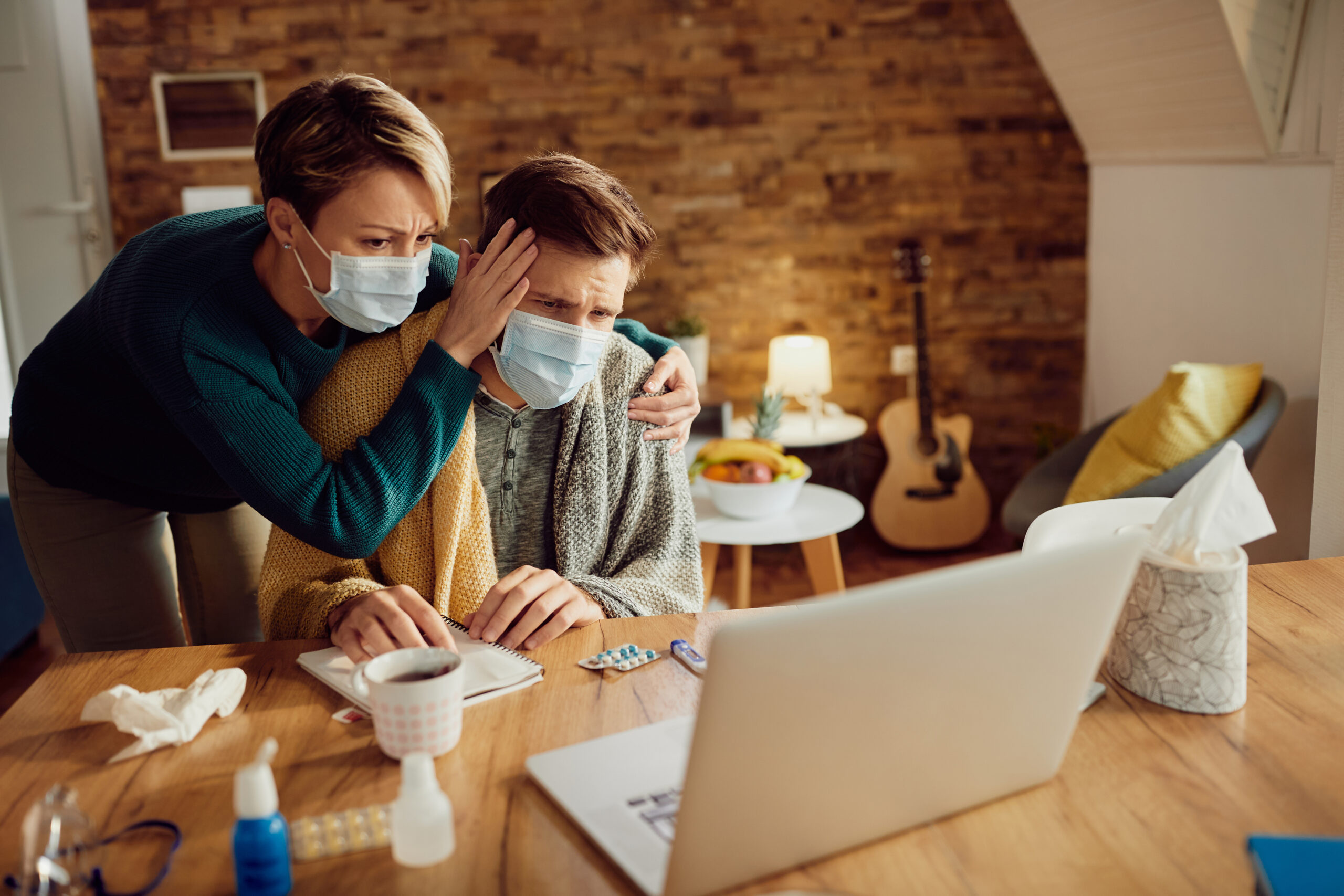Couple searching for super flu prevention tips online
